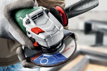 Bosch PWS 1300-125 CE Winkelschleifer + Koffer 